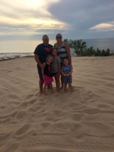LSS teacher Julie McCullough with her family at the beach